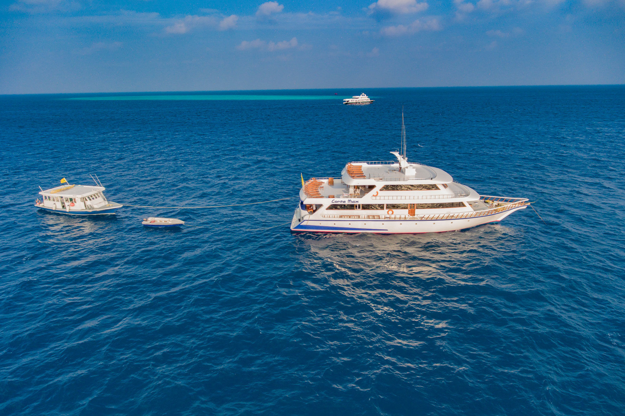 MY Conte Max — conte-max-outside-with-dhoni--dinghy.jpg